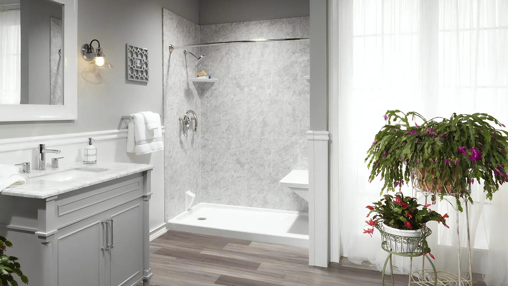 Newly installed tiled walk-in shower with glass door